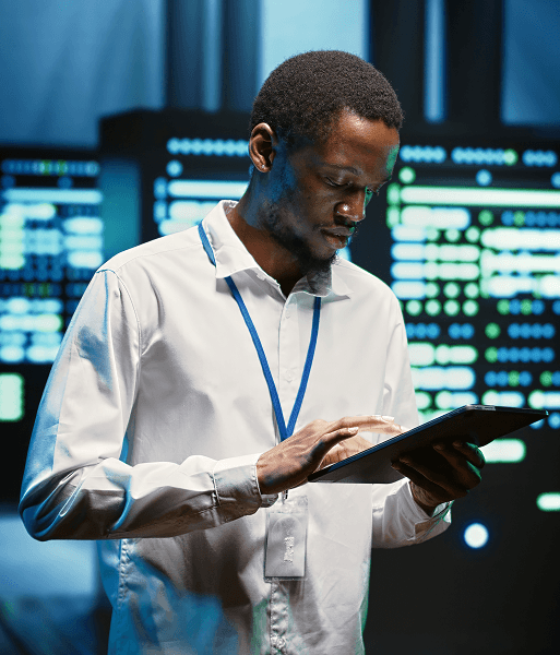 Man with tablet in data center